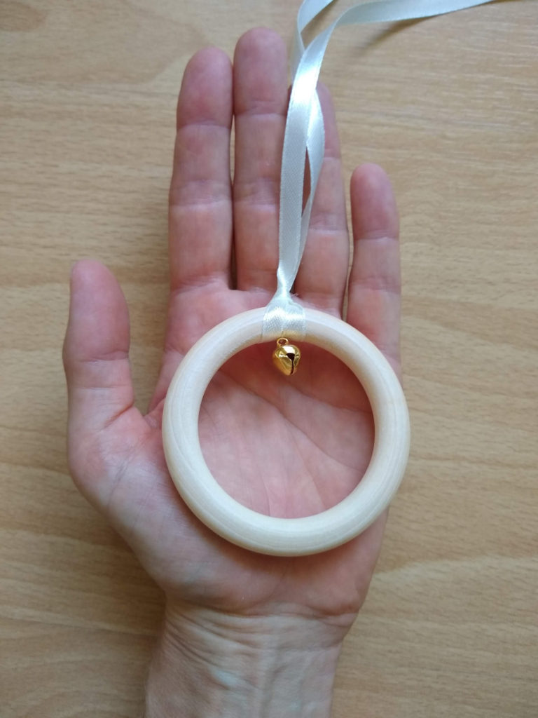 Montessori Ring on a Ribbon mobile in hand