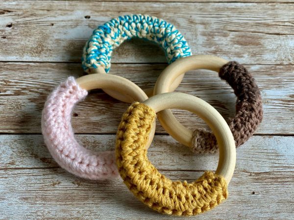 Four crochet teething ring on top of each other