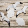 Flat lay photo of the DIY Montessori Seagull mobile