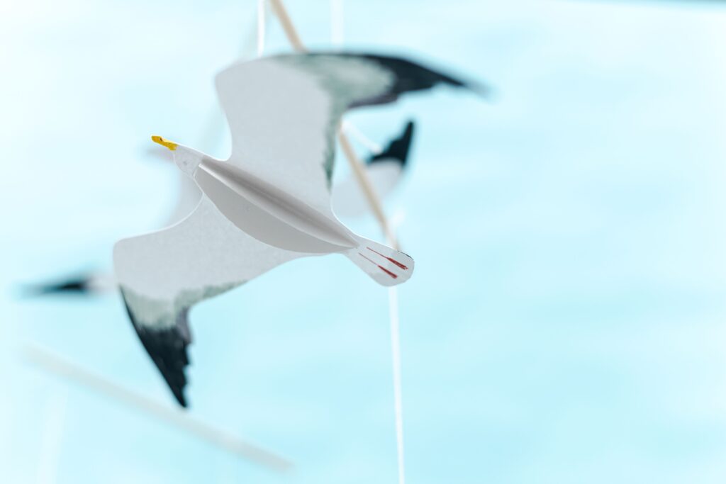 Close-up of Montessori Seagull mobile showing wing detail and colour accents