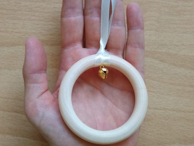 Montessori Ring on a Ribbon mobile in hand